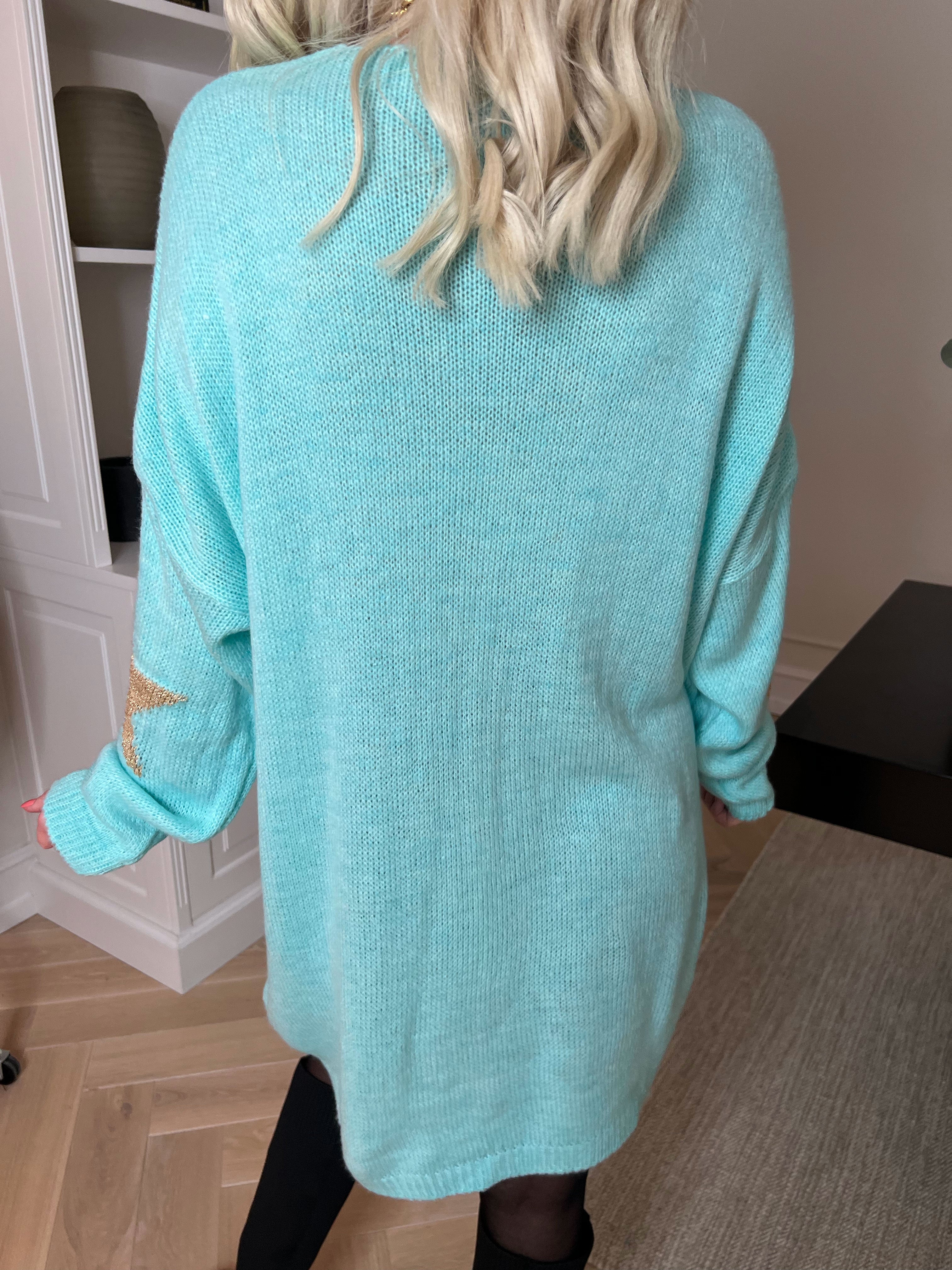 Nikola - Strikkjole med guldstjerner og v-udskæring